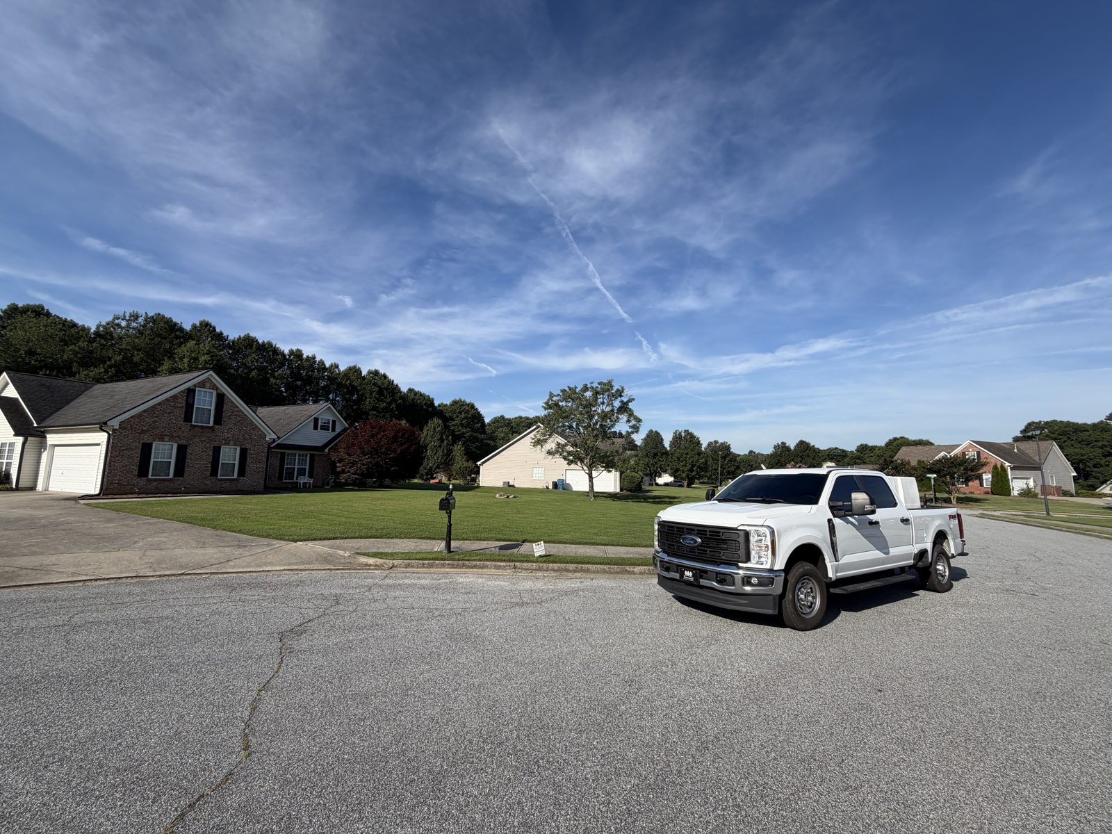 Briarwood Turf Care truck at a treated lawn